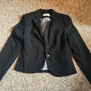 Black Calvin Klein blazer. 6P